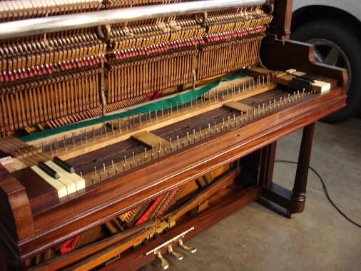 60 - Keys, punchings, blocks, keyslip dry-fitted at both ends of piano 60 - Keys, punchings, blocks, keyslip dry-fitted at both ends of piano